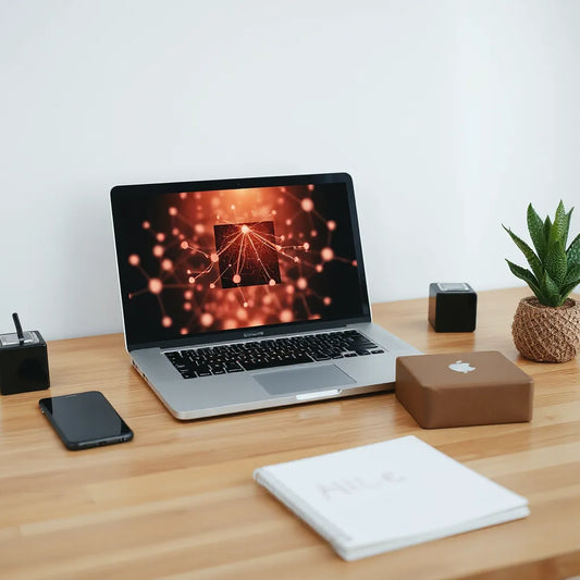Minimal desk with laptop displaying an abstract AI network visual for online business automation