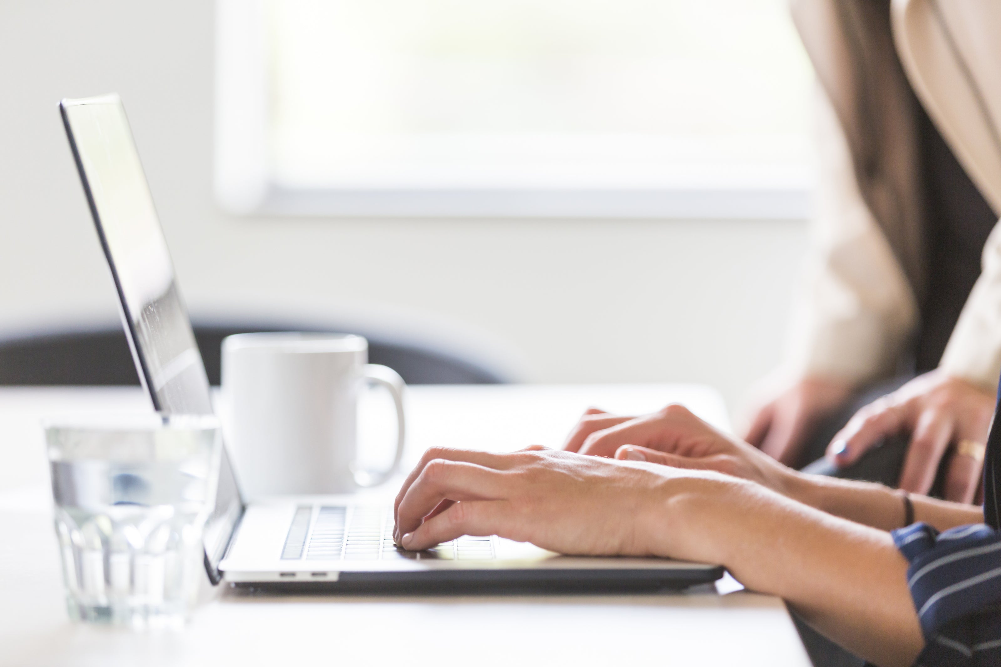 Woman at computer learning a new skill