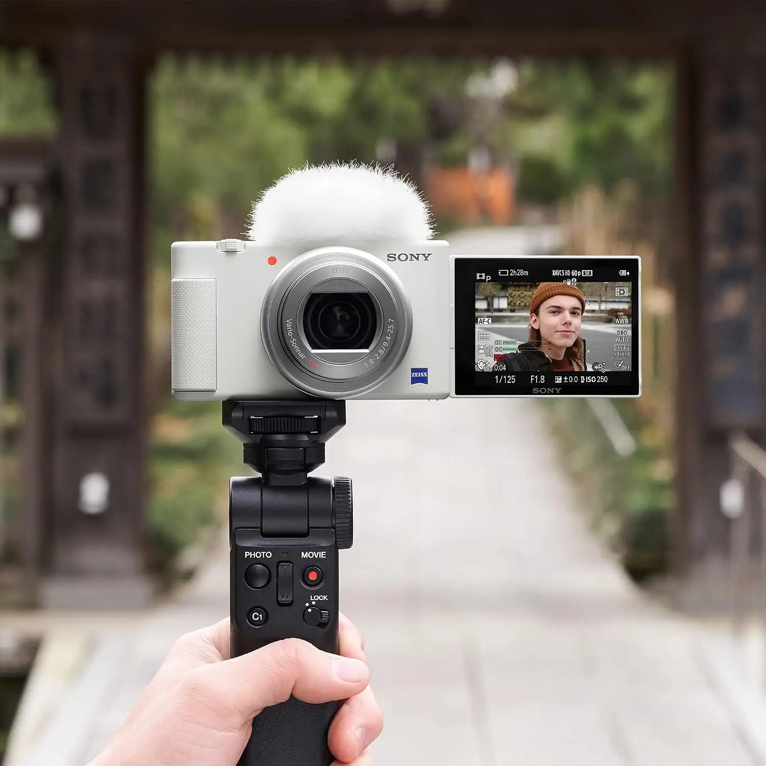 White sony zv-1 camera with fluffy white microphone and image stabilization for content creators and vloggers
